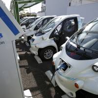 Toyota super-compact electric vehicles are charged at the Smart Mobility Park electric mobility charging station Toyota, Aichi Prefecture. When electric vehicles' day comes, it will be suddenly