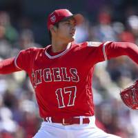 Los Angeles manager Mike Scioscia (top left) said Thursday that star Shohei Ohtani will not pitch next year. The hurler is considering having Tommy John surgery on his pitching arm. Scioscia says Ohtani won't pitch in '19
