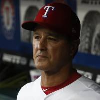 Rangers interim manager Don Wakamatsu stands in the dugout on Friday in Arlington, Texas. Struggling Rangers fire Jeff Banister, name Don Wakamatsu interim manager