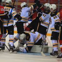 Players from the Boston Bruins and Calgary Flames fight during an NHL exhibition game on Saturday in Shenzhen, China. AFP-JIJI Bruins beat Flames in shootout in NHL China Games opener