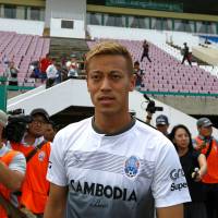 Former Japan star Keisuke Honda arrives for a Cambodian national team training session at Olympic Stadium in Phnom Penh on Tuesday. Keisuke Honda hoping for chance to compete against Usain Bolt in A-League