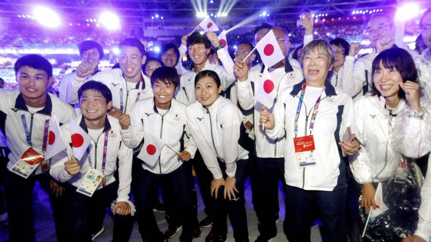 Swimmer Rikako Ikee (center) poses with other members of the Japanese delegation during the closing ceremony of the Asian Games on Sunday in Jakarta. Rikako Ikee promises to keep working as Asiad ends