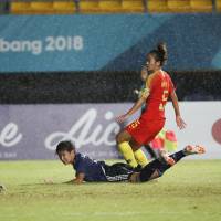 Yuika Sugasawa (center) scores the winning goal against China in the women’s soccer final at the Asian Games on Friday night. Yuika Sugasawa's late winner secures gold for Japan