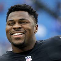 NFL defensive end Khalil Mack smiles in an Oct. 29, 2017 file photo. The 27-year-old was traded from the Oakland Raiders to the Chicago Bears on Saturday in a blockbuster deal. Raiders send star pass rusher Khalil Mack to Bears in massive trade