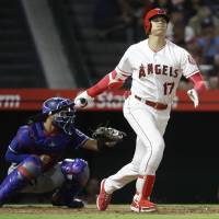 The Angels’ Shohei Ohtani strikes out during the fourth inning against the Rangers on Tuesday. Shohei Ohtani's eight-game hitting streak ends as Angels beat Rangers