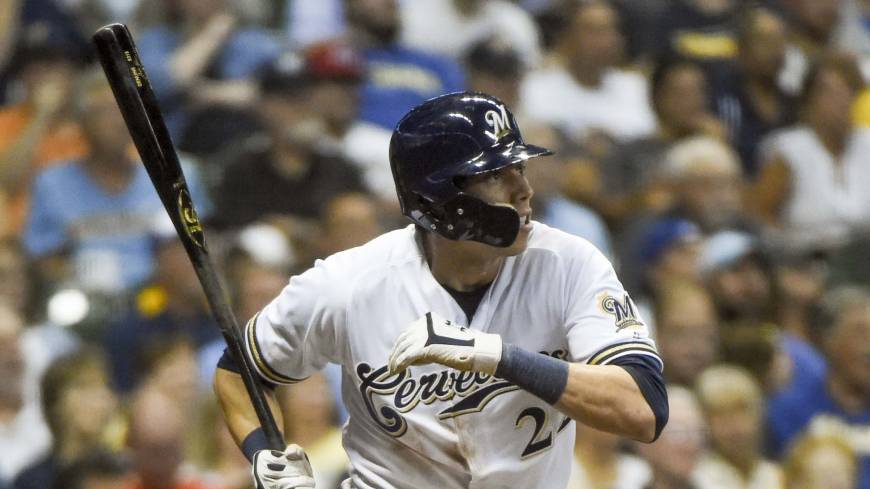 The Brewers’ Christian Yelich smacks a sixth-inning triple against the Reds on Monday at Miller Park. Brewers' Christian Yelich hits for historic cycle against Reds