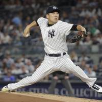 Yankees starter Masahiro Tanaka fires a pitch in the first inning against the Red Sox on Thursday in New York. Red Sox rout Yankees, clinch AL East crown for third straight year