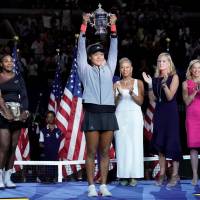 Naomi Osaka holds the U.S. Open trophy aloft after beating Serena Williams in the women’s final of the 2018 U.S. Open tennis tournament at Arthur Ashe Stadium, inside USTA Billie Jean King National Tennis Center. Analysis: In drama-filled match, Naomi Osaka shows her mettle with historic win over Serena Williams