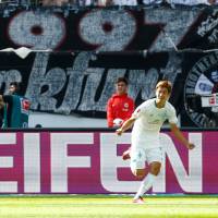 Werder Bremen’s Yuya Osako celebrates scoring his team’s first goal on Saturday at Commerzbank-Arena in Frankfurt, Germany. Osako nets first league goal for Werder in win over Eintracht