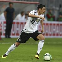 Germany’s Mesut Ozil dribbles the ball during a friendly on June 2 against Austria. Mesut Ozil's absence casts shadow over German national squad