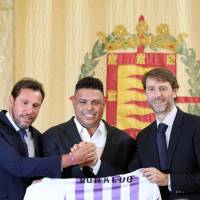 Brazilian football legend Ronaldo (center) holds a symbolic Real Valladolid jersey as he poses with Valladolid mayor Oscar Puente (left) and Real Valladolid president Carlos Suarez during a new conference on Monday to announce his purchase of 51 percent of the club’s shares. Brazil great Ronaldo buys majority stake in La Liga's Real Valladolid
