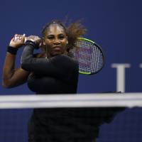 Serena Williams hits a return during her match against Karolina Pliskova at the U.S. Open on Tuesday in New York. Williams won 6-4, 6-3 to advance to the semifinals. Serena shakes off slow start to reach U.S. Open semifinals