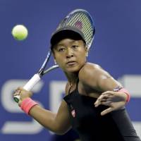 Naomi Osaka returns a shot to Madison Keys in their semifinal match at the U.S. Open on Thursday. Osaka won 6-2, 6-4 to become the first Japanese woman to reach a Grand Slam singles final. Naomi Osaka to take on idol Serena Williams in final