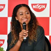 U.S. Open winner Naomi Osaka speaks at a news conference in Yokohama on Thursday morning. New star Naomi Osaka arrives in Tokyo to hero's welcome