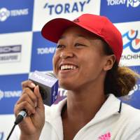 Naomi Osaka speaks at a news conference on Monday ahead of the Pan Pacific Open. Naomi Osaka connects with Japanese roots by watching sumo