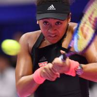Naomi Osaka plays a shot from Barbora Strycova of Czech Republic in their quarterfinal match at the Toray Pan Pacific Open on Friday. Naomi Osaka rolls into Toray Pan Pacific Open semis