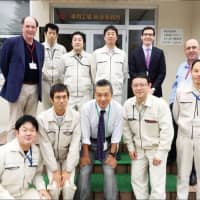Rennicks Group Managing Director Michael Flanagan (standing, far left), Group Technical Manager Sean Coffey and Commercial Manager Cathal D’Arcy with the Nippon Carbide Industries team led by Group Sales Manager Hiroshi Ata and Optical Products Development Division Manager Takeo Takamatsu