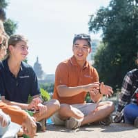 Students interact on campus at the university’s iconic South Mall. | UT-AUSTIN