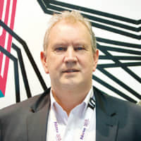 Michael Finn, Managing Director of Nitto Denko (Australia) Pty Ltd. Background art using Nitto’s Haru stuck-on design PET tape | © SMS