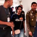 Rahaf Mohammed Alqunun is escorted by a Thai immigration officer and United Nations High Commissioner for Refugees officials at Suvarnabhumi International Airport in Bangkok on Monday. She says her father physically abused her and tried to force her into an arranged marriage.