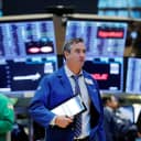 Traders work on the floor of the New York Stock Exchange on Tuesday.