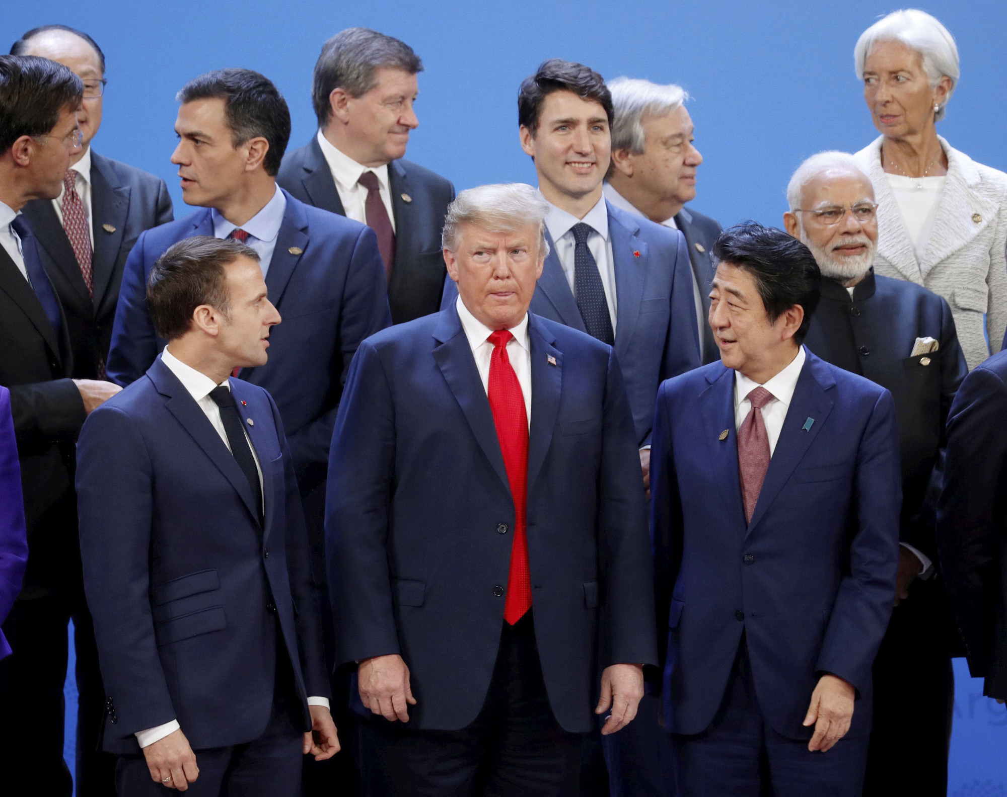 U.S. President Donald Trump and Prime Minister Shinzo Abe prepare for a photo-op during the Group of 20 summit in Buenos Aires last November. | REUTERS / VIA KYODO
