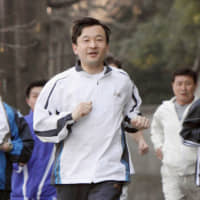 Then-Crown Prince Naruhito runs around Akasaka Estate in Tokyo in March 2008. | KYODO