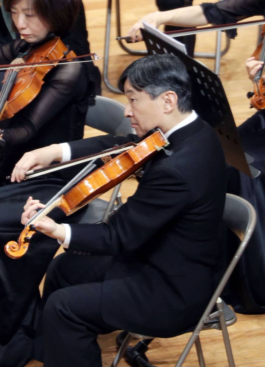 Then-Crown Prince Naruhito plays viola at a concert in an orchestra of Gakushuin University graduates in Tokyo on Dec . 9, 2018.