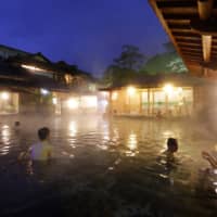 Men and women bathe together in Ryugu-no-yu wearing bathing clothes provided by the inn.