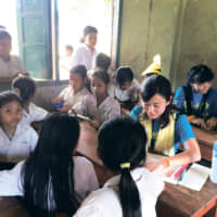Sophia students during study tours in Laos. | SOPHIA UNIVERSITY