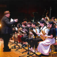 Trombonist and Seiko Summer Jazz Camp lead instructor Michael Dease conducts a big band performance with all the students during last year's gala concert at Shobi Vario Hall in Tokyo on Aug. 17, 2018. | SEIKO SUMMER JAZZ CAMP