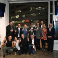 Representatives from eight startups taking part in the Global Startup Program with Italian Ambassador to Japan Giorgio Starace (back row, third from left) at a pitching event held on Sept. 11 at EDGEof in Shibuya Ward. | YOSHIAKI MIURA