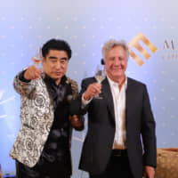 Handa raises a toast with actor Dustin Hoffman at the hotel on Dec. 8. | ISPS