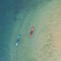 Kayakers explore the waters off of Tsushima island. | FUTA NAGAO