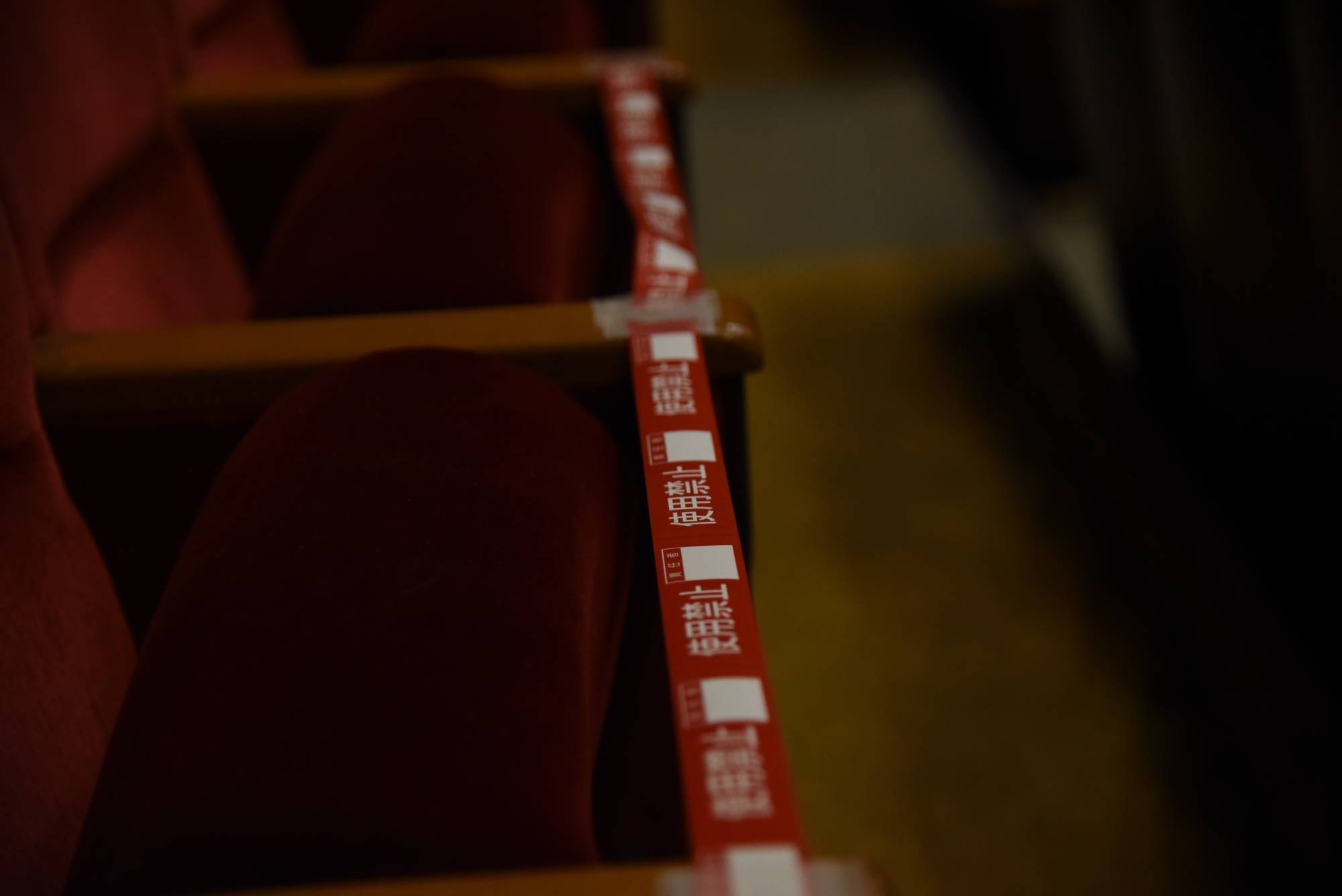 Seats in Ryogoku Kokugikan are blocked off by tape to ensure physical distancing. | DAN ORLOWITZ 
