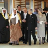 Above: The late amir of Kuwait (second from left) is escorted by Emperor Emeritus Akihito and Empress Emerita Michiko  through the Imperial Palace during a 2012 state visit to Tokyo.   | REUTERS / IMPERIAL HOUSEHOLD AGENCY OF JAPAN