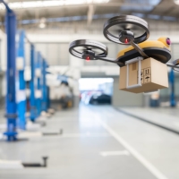A delivery drone flies inside of the garage storage in an automotive car service center. The drone business has been expanded to the various fields and is expected develop more as a growth industry. | GETTY IMAGES
