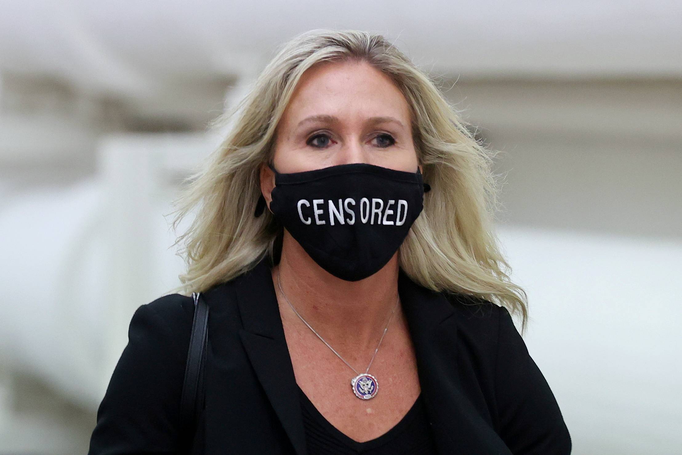 Republican U.S. Rep. Marjorie Taylor Greene wears a mask reading