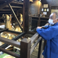 Wakatsuru Sabomaru Distillery’s distinctive cast still (background) was made by a local foundry with a rich history of making huge temple bells. | JANE KITAGAWA