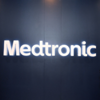 Mayumi Kimura (left) and Kiyoe Izumi pose in front of Medtronic Japan Co.’s logo at its headquarter in Shinagawa, Tokyo.  | YOSHIAKI MIURA