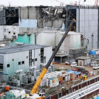 Tokyo Electric Power Co. discloses its debris clearing work to the press at the Fukushima Daiichi nuclear power plant's No. 3 reactor on Sept. 4, 2015, ahead of the four and a half year mark of the 2011 disaster. | KYODO