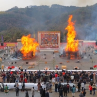 Magnificent orange pillars of fire burst from two gomadan pyres at the Agon Shu Fire Rites Festival in Kyoto on Feb. 7. | 

