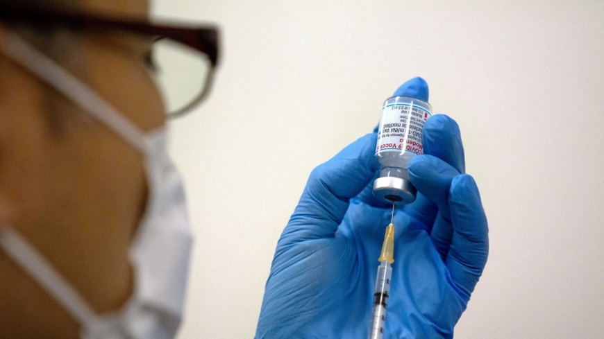 Japan to open up COVID-19 booster shots to all residents