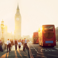 London buses cross Westminster Bridge toward the Palace of Westminster and the iconic Big Ben clock tower. | © IAKOV KALININ/SHUTTERSTOCK.COM