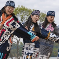 Four women perform an Ainu ritual at the Symbolic Space for Ethnic Harmony, also known as Upopoy, in Shiraoi, Hokkaido, in 2020.  | FOUNDATION FOR AINU CULTURE