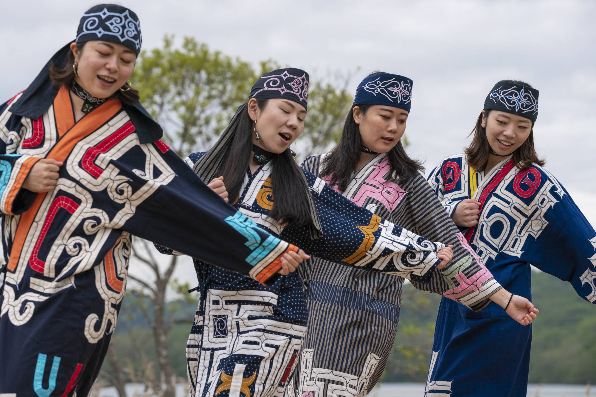Four women perform an Ainu ritual at the Symbolic Space for Ethnic Harmony, also known as Upopoy, in Shiraoi, Hokkaido, in 2020.  | FOUNDATION FOR AINU CULTURE