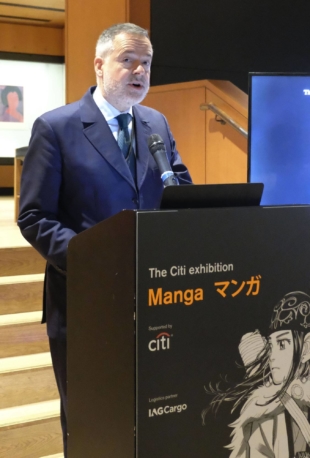Hartwig Fischer, director of the British Museum in London, announces a manga exhibition in front of a board with the image of Asirpa, one of the main characters in "Golden Kamuy," in December 2018. | KYODO
