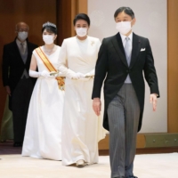 Princess Aiko walks behind her parents Emperor Naruhito and Empress Masako on the way to her coming-of-age ceremony at the Imperial Palace in Tokyo on Dec. 5. | KYODO
