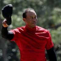 Tiger Woods walks off the 18th green during the final round of the Masters in Augusta, Georgia, on April 10. | REUTERS