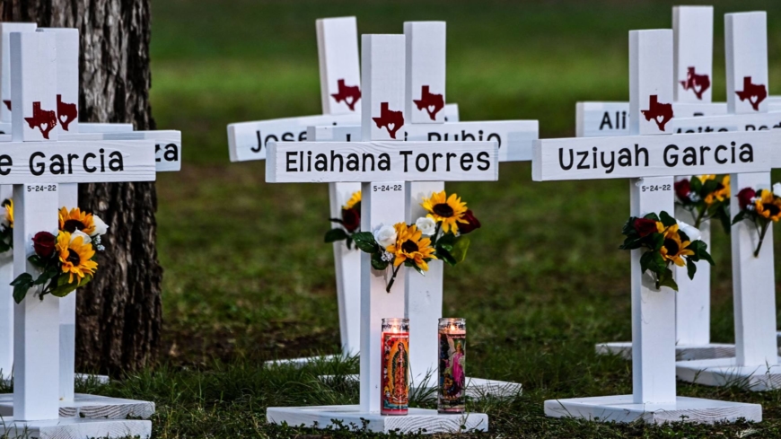 Crosses adorn a makeshift memorial for the shooting victims at Robb Elementary School in Uvalde, Texas, on Thursday. 